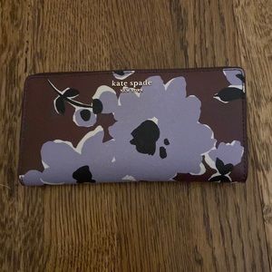 Kate Spade fold over wallet with purple floral detail